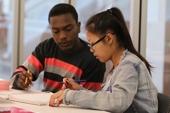 Two students collaborating in a classroom
